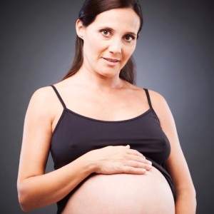 Pregnant mother showing her belly.